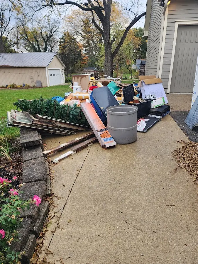 Dumpster being loaded with debris for Roofing Dumpster Rental in Cicero